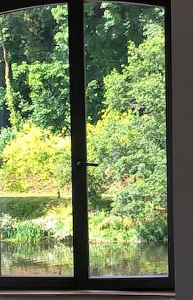 Riverside Cottage - here a view on the river and the hill from the living room